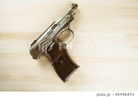 the gun is on the table 46496854