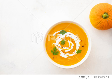Pumpkin soup with cream and pumpkin seeds isolated on white background. Autumn concept. 46498973