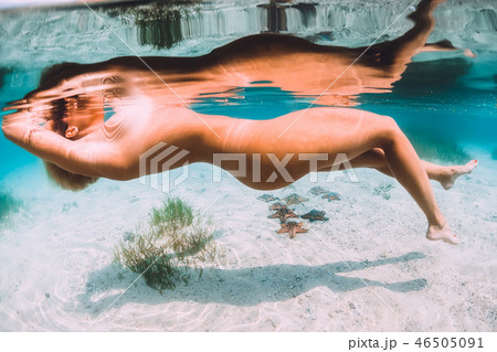 Slim woman floating and relax in tropical ocean 46505091