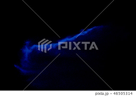 Blue colored sand explosion isolated on black back Blue colored sand explosion isolated on black back 46505314