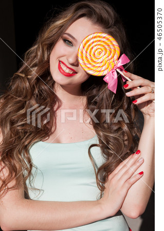 beautiful woman eats sweet candy lollipop sweets tasty beautiful woman eats sweet candy lollipop sweets tasty 46505370