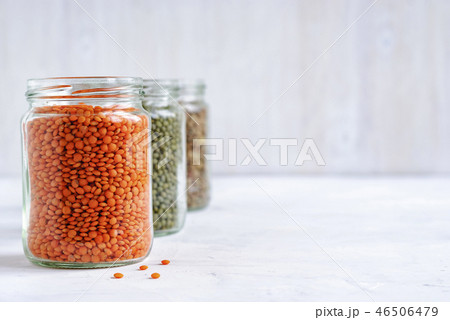 Red or orange lentils in a glass storage jar 46506479
