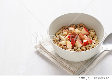Bowl of oatmeal with apple with the spoon Bowl of oatmeal with apple with the spoon 46506512