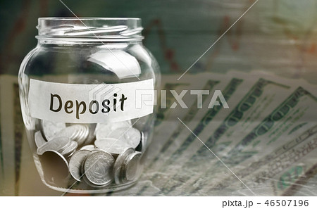 Glass jar with coins and the inscription 46507196