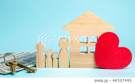 Family stands near the house. Affordable housing. Family stands near the house. Affordable housing. 46507495