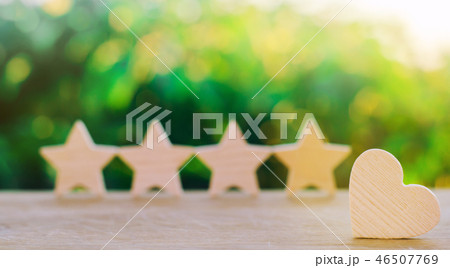 four stars and heart on a green bokeh background 46507769