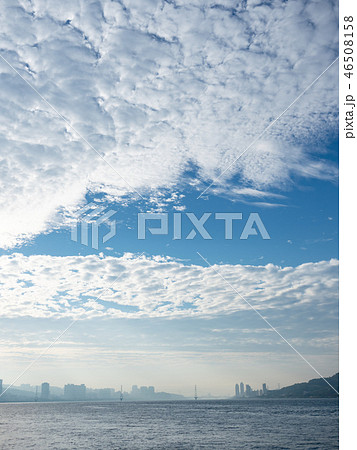 Misty landscape with river, bridge and buildings 46508158