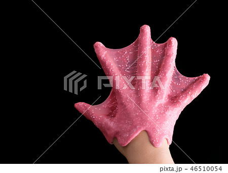 The hand of the child is covered with pink mucus. The hand of the child is covered with pink mucus. 46510054