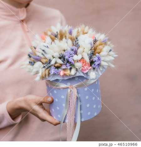Colorful bouquet of different dried flowers deadwood flowers in the hands of florist woman. Rustic Colorful bouquet of different dried flowers deadwood flowers in the hands of florist woman. Rustic 46510966