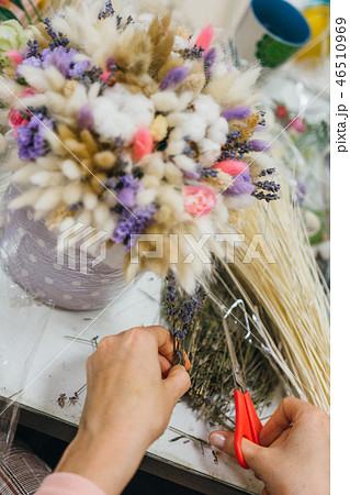 The process of making a bouquet. Colorful bouquet of different dried flowers deadwood flowers in the The process of making a bouquet. Colorful bouquet of different dried flowers deadwood flowers in the 46510969