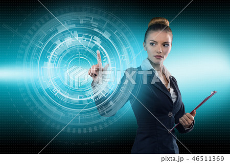 Young business lady works with virtual graphic interface in futuristic office Young business lady works with virtual graphic interface in futuristic office 46511369