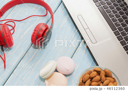 open laptop with, marshmallows and red headphones. 46512360