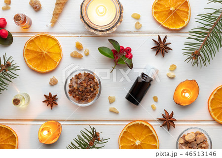 Christmas background with essential oil bottles Christmas background with essential oil bottles 46513146