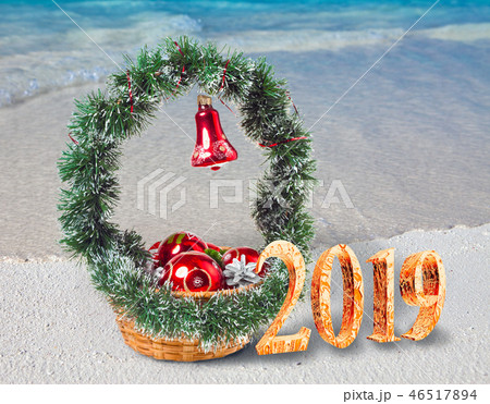Christmas decorations on the sandy seashore and th Christmas decorations on the sandy seashore and th 46517894
