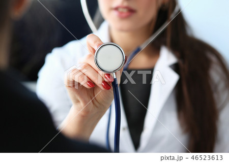 Beautiful smiling female doctor hold in arm 46523613
