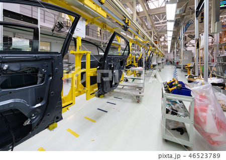 car door on conveyor. Robotic equipment makes Assembly of car. Modern car Assembly at factory car door on conveyor. Robotic equipment makes Assembly of car. Modern car Assembly at factory 46523789