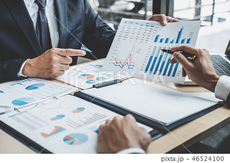 Two executive discussing company growth project success financia 46524100