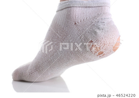 Ripped white sock on male leg isolated 46524220