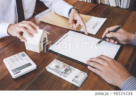 Business Signing a Contract Buy - sell house, Man sign a home in 46524238
