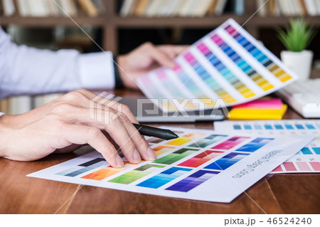 Image of male creative graphic designer working on color selecti 46524240