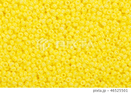 Many yellow glass beads on macro, texture. 46525501