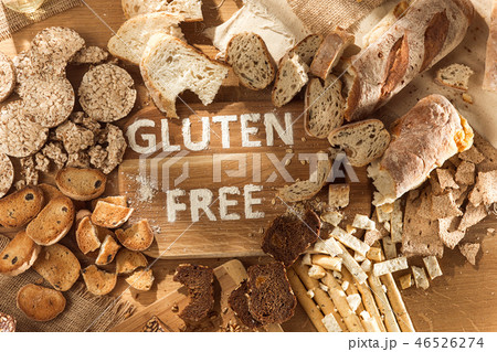 Gluten free food. Various pasta, bread and snacks on wooden background from top view Gluten free food. Various pasta, bread and snacks on wooden background from top view 46526274