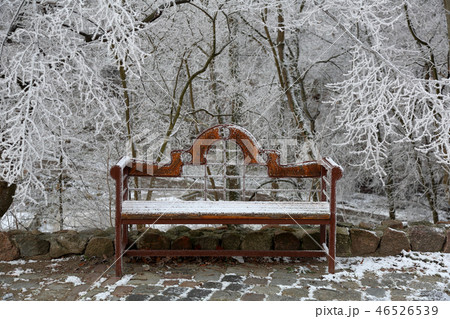 Wooden bench in the snow 46526539