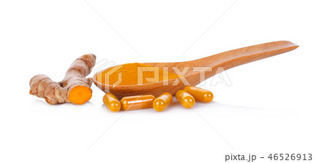 turmeric powder and capsules on white background 46526913