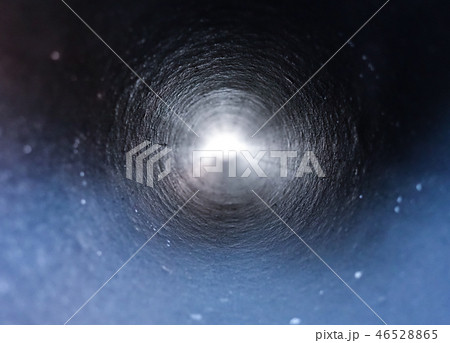 Inside view of a round plastic pipe.   46528865