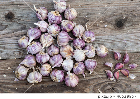 Garlic cloves on wooden vintage background. Garlic cloves on wooden vintage background. 46529857