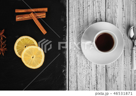 hot coffe, cinnamon sticks, star anise and lemon 46531871