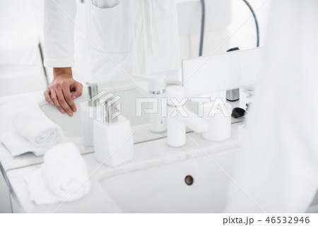 Close up of the sink and person putting hand on it 46532946