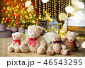 Family of teddy bears siting under the christmas tree with presents 46543295