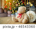 Teddy bears siting under the christmas tree with presents 46543360