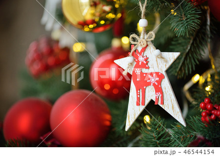Decorated Christmas tree on blurred, sparkling and fairy background 46544154