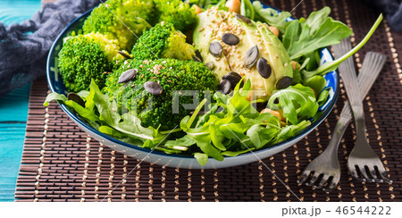 Green plant based salad with broccoli and avocado 46544222