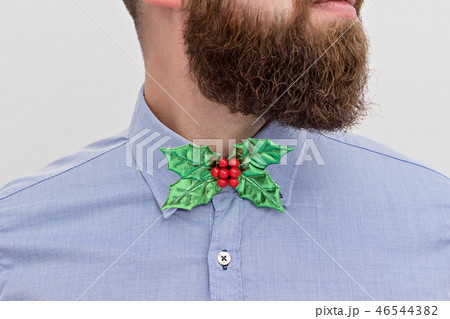 Bearded hipster with festive Christmas bow tie Bearded hipster with festive Christmas bow tie 46544382