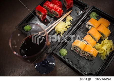 Almost eaten Japanese rolls, packed in containers 46548898