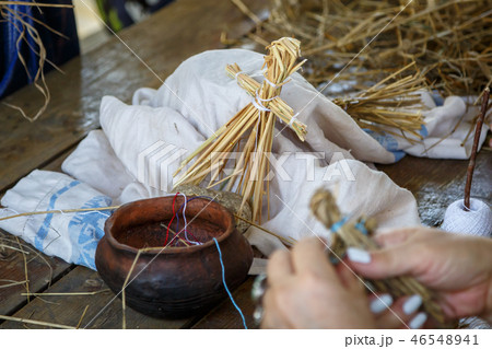 A toy made of straw in the shape of a little human A toy made of straw in the shape of a little human 46548941