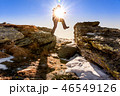 man jumps among the rocks 46549126