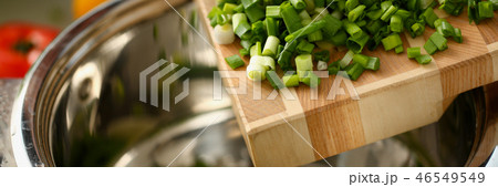 Cook holds knife in hand and cuts on 46549549