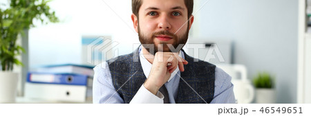 Handsome smiling bearded clerk man at office workplace Handsome smiling bearded clerk man at office workplace 46549651