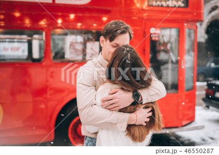 beautiful young couple posing by the old bus 46550287