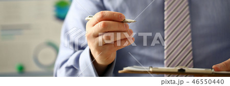 Male arm in suit offer contract form on clipboard Male arm in suit offer contract form on clipboard 46550440