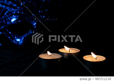 Candles and a masquerade mask in the dark Candles and a masquerade mask in the dark 46551210