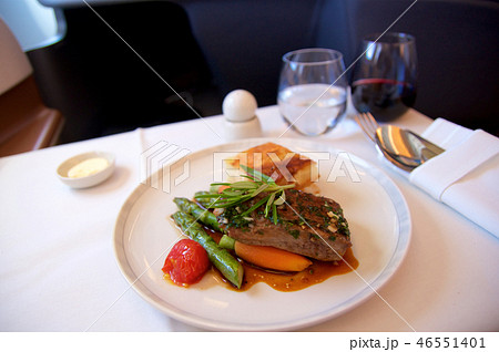 SINGAPORE, - JULY 22, 2016: grilled lamb fillet in Rosmarinjus with carrots, asparagus, cherry 46551401