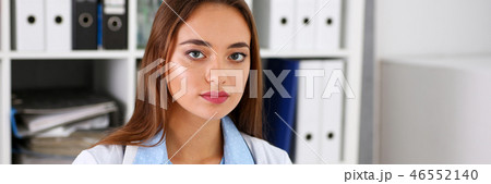 Beautiful smiling female doctor in office Beautiful smiling female doctor in office 46552140