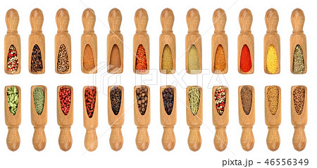 mix of spices in wooden scoop isolated on a white background. Top view. Flat lay. Set or collection 46556349