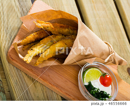 Pan-fried anchovies with creamy cheese sauce, greens Pan-fried anchovies with creamy cheese sauce, greens 46556666