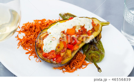 Eggplant baked with vegetables and tzatziki 46556839